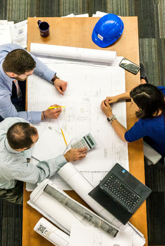 People in Meeting People at Boardroom Desk